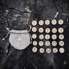 Load image into Gallery viewer, Hazel wood Elder Futhark rune set hand-engraved in pyrography and handcrafted organic linen pouch Misty Stroll